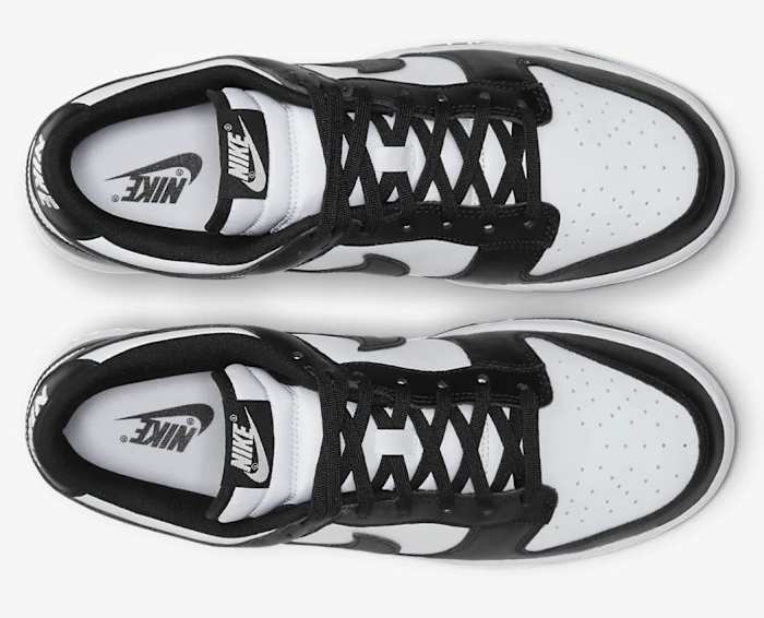 View of white and black Nike Dunk shoes.